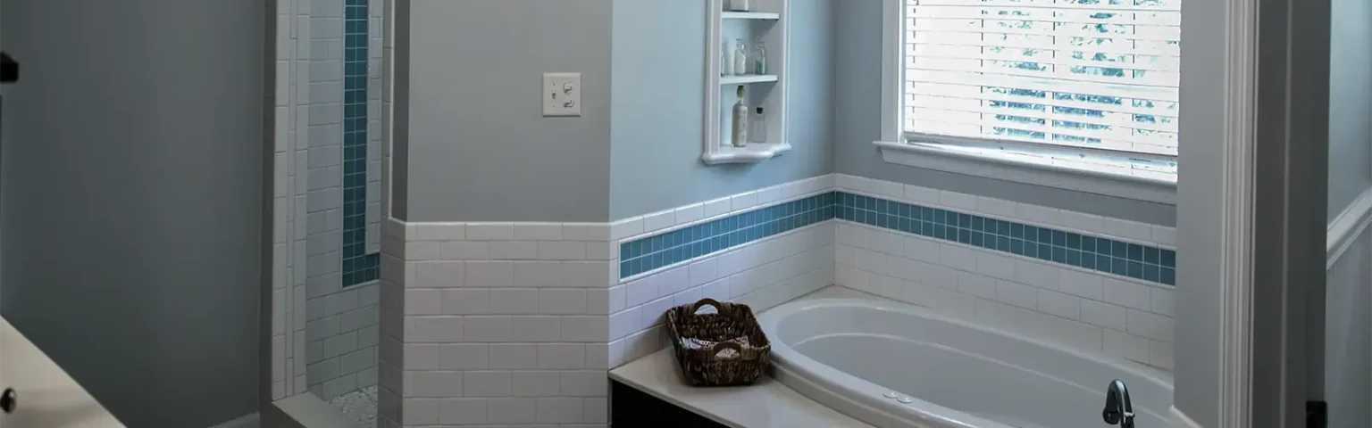 bathroom showing tub and standing shower